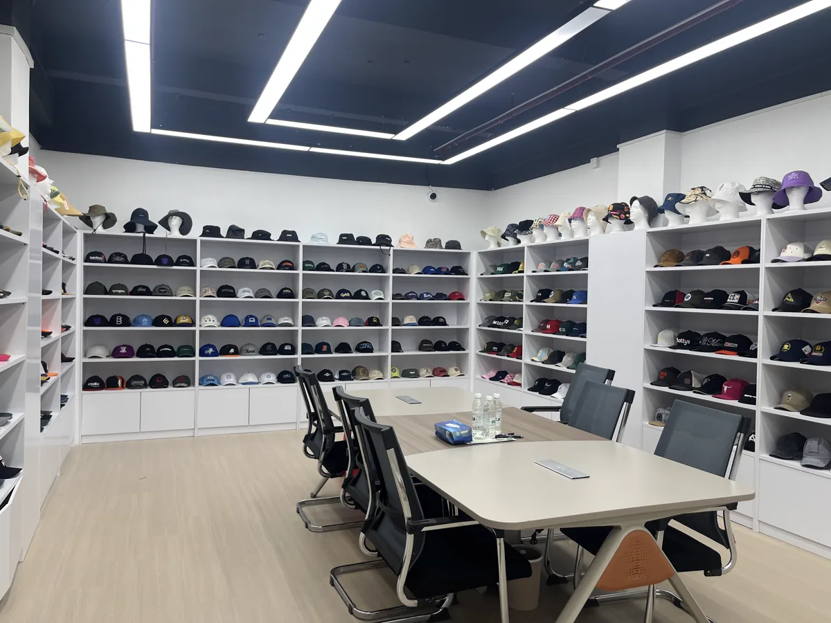 SXMX showroom displaying a wide range of custom cap and hat samples
